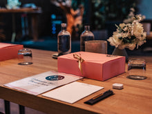 Roze starterspakket met Extension Bar theorieboek en werkmateriaal op tafel